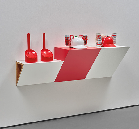 photo of installation of red and white objects on red and white shelves