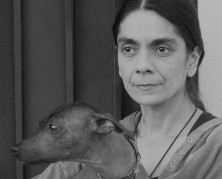 Black and white photo of Mariana Wardwell with a small dog