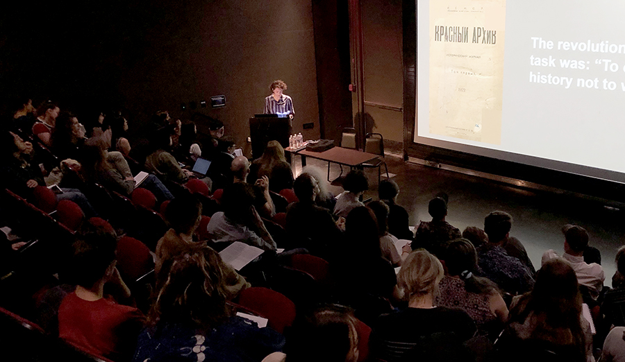 photo of presenter in lecture hall