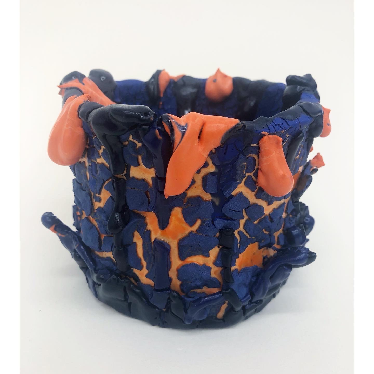 Photo of a blue and orange cup shaped sculpture