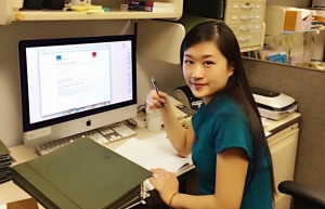 Photo of Yiqing Li at a computer