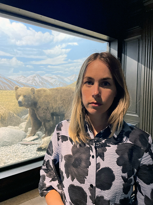 Vanessa Bateman with the Grizzly Bear diorama at the Natural History Museum of Los Angeles County, 2022.